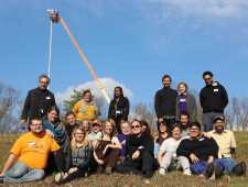 Members of the Southern Connected Communities Network pose by the Highlander Research and Education Center in New Market, Tennessee. (SCCN)