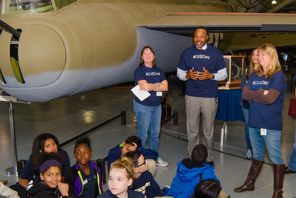 James Collins talking to kids at GIS Day