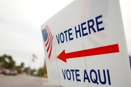 "vote here" sign