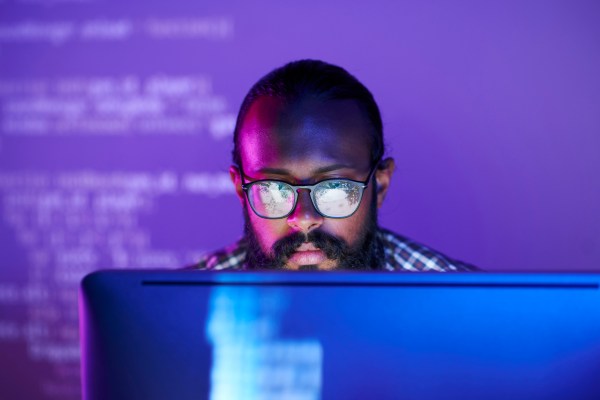 Programmer in front of monitor