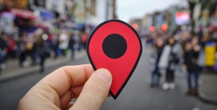 man holding location marker