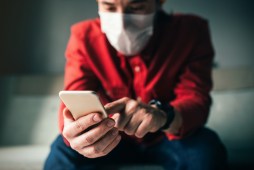 man with smartphone and mask