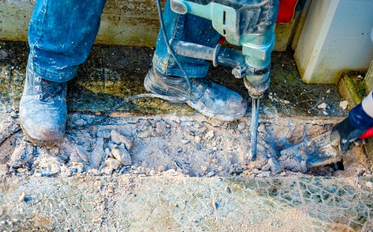 man using jackhammer