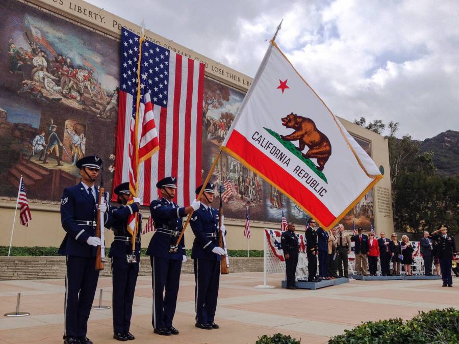 military members holding flags